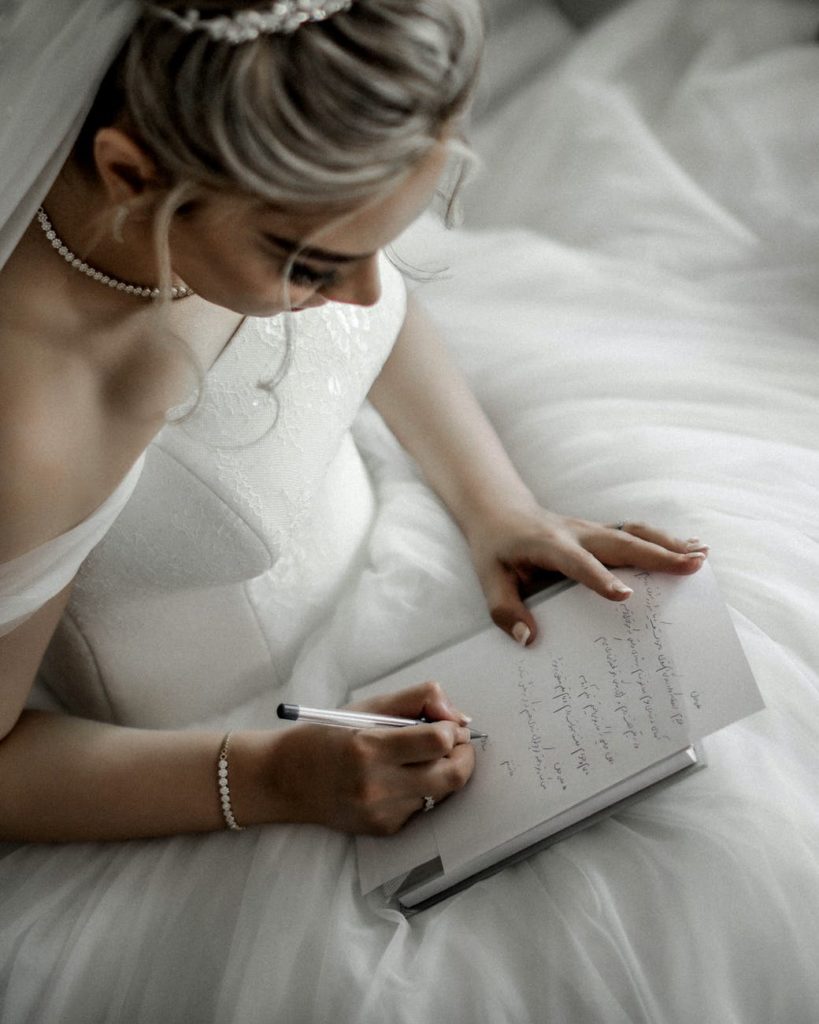 bride writing her own vows for unique wedding ceremony ideas.